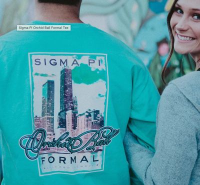 Person wearing teal Sigma Pi Orchid Ball Formal Tee with cityscape design.