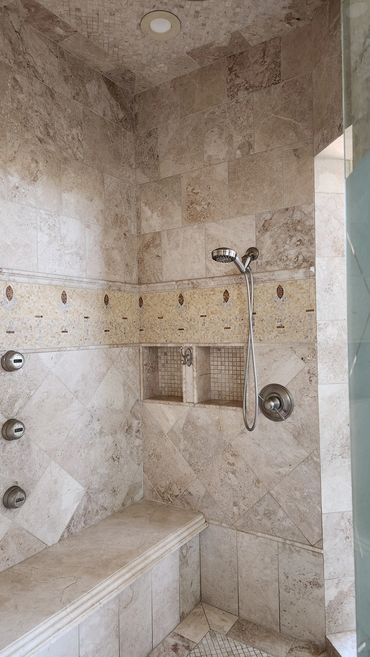 Travertine shower cleaned and sealed by Stone Master and Tile Care