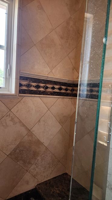 Travertine shower cleaned and sealed by Stone Master and Tile Care
