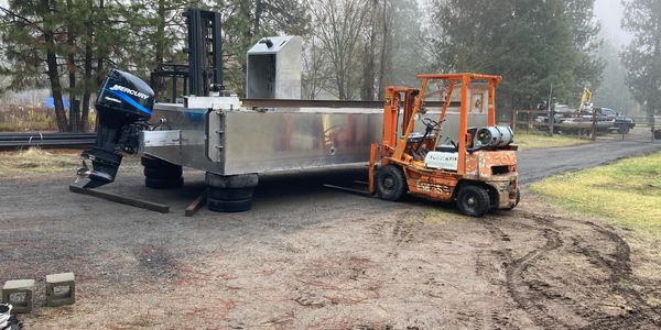 Work barge for pile driving and barging services
