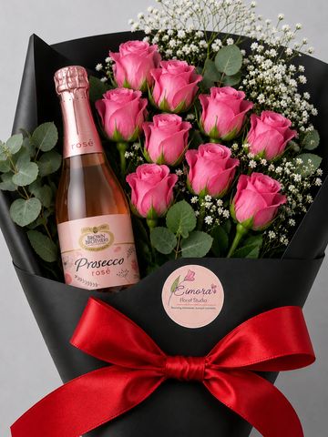 Elegant bouquet with pink roses and Prosecco rosé, wrapped in black with a red bow.