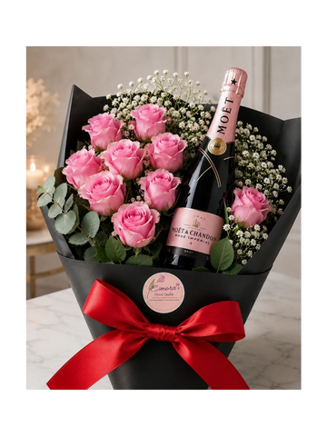 Elegant bouquet with pink roses and a bottle of Moët champagne.