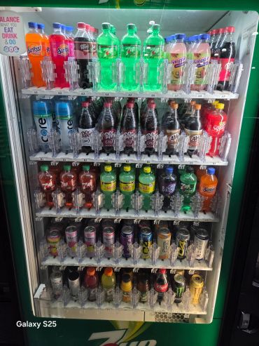 Energy-efficient beverage vending machine stocked with popular cold drinks and cashless payment tech