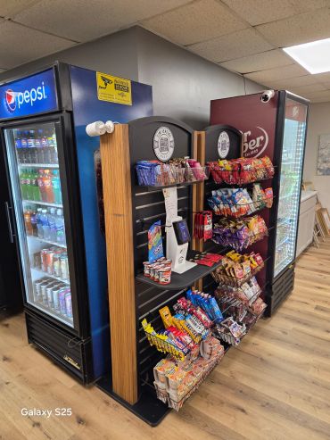 Self-service micro market with modern touchscreen checkout providing fresh food, snacks, beverages,