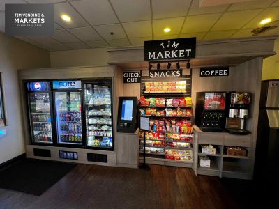 Small indoor market with snacks, drinks, and coffee.
