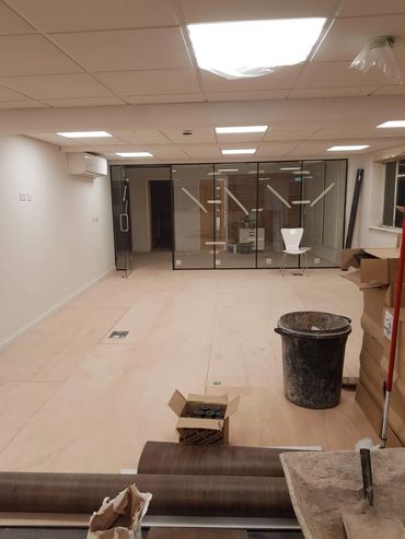 glass partition install in office refurb