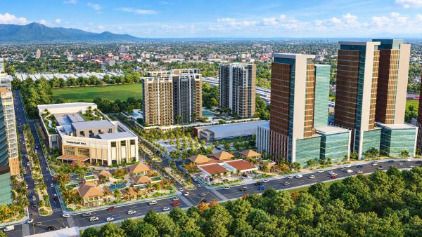 Modern urban complex with tall buildings and green spaces.