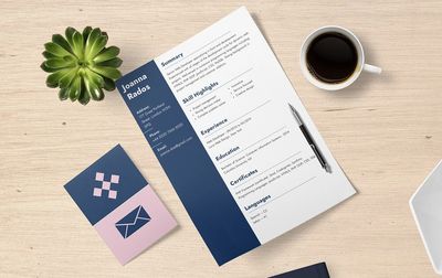 resume on table with coffee and business card
