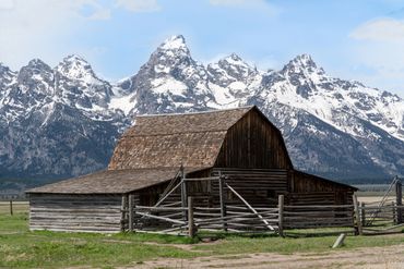 Mormon Row barn with the backdrop of Grand Teton National Park in Wyoming.