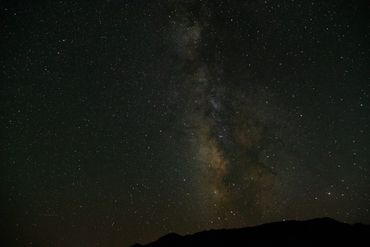 The milky way is cast above the mountains in Great Basin National Park, Nevada.