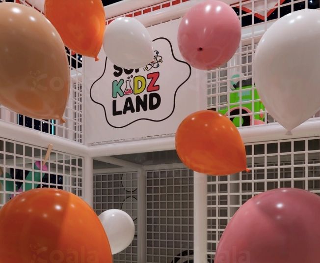 Colorful balloons decorate the entrance of a kids' play area called Kidz Land.