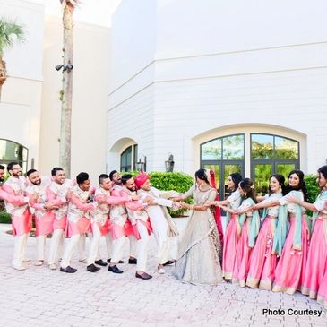 Beautiful Indian Bride and Groom enjoying their time with the Bridesmaid and the Groomsmen