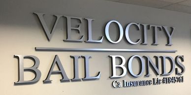 Brushed metal letter sign