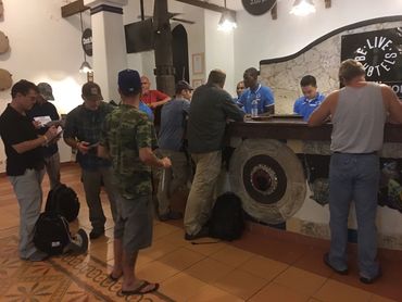 Bradley Williamson with Josh Gates and production team checking into resort after staying on Mona.