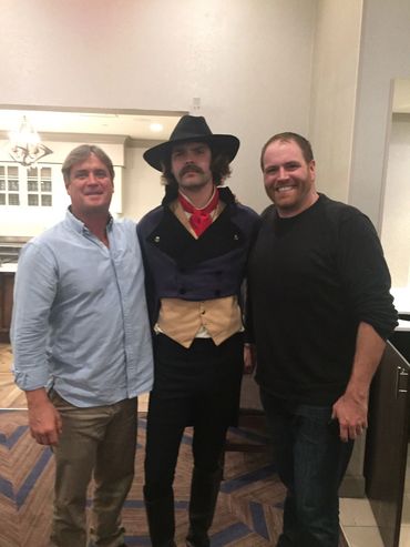 This is a "behind the scenes" photo of Bradley Williamson (blue shirt),