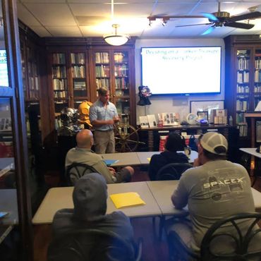 Bradley Williamson speaking at finding lost and sunken treasure seminar.