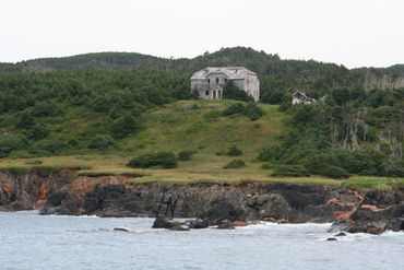 Abandoned mansion on coastline of Canada on st Paul island where I found sunken treasure.