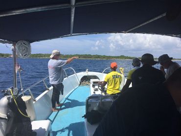 Captain guiding dive boat to shipwreck site of the Quedagh Merchant.