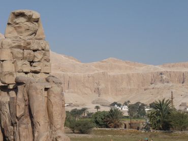 Looking at Colossus with the Valley of the Kings off in the distance.