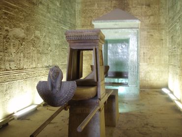 Inside Egyptian tomb with Egyptian artifacts.