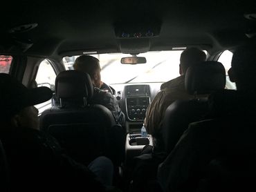 This is a typical scene. All of us piled into a van heading to location for filming.