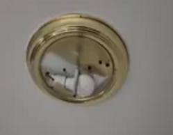 Ceiling light fixture missing cover exposing bulb in York PA home