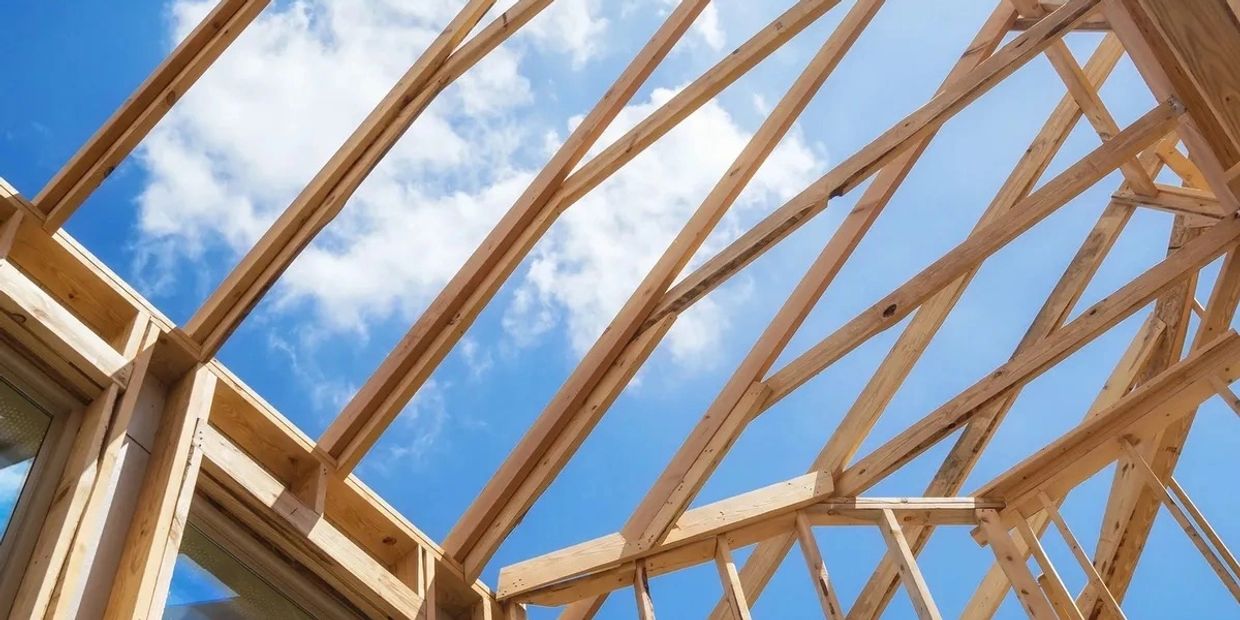 Wooden frame structure of a house under construction.