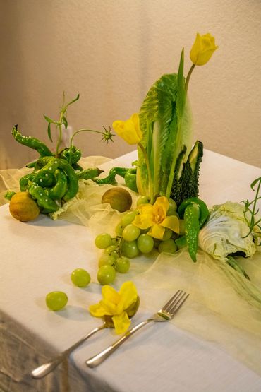 What's on the table? A table arrangement with fruits and vegetables. Ikebana inspired.