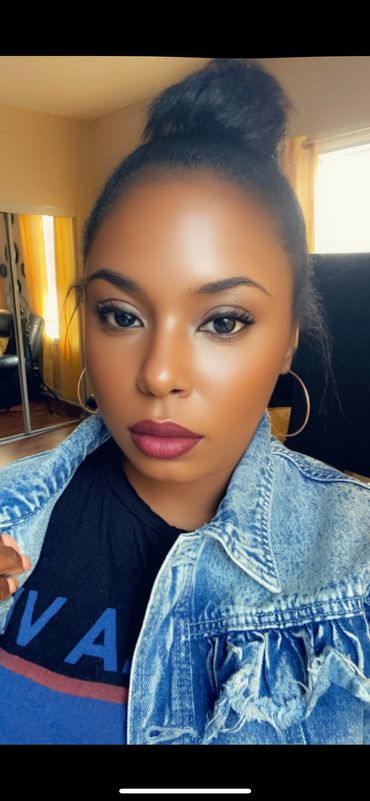 owner of Artista wearing classic lashes and gloss