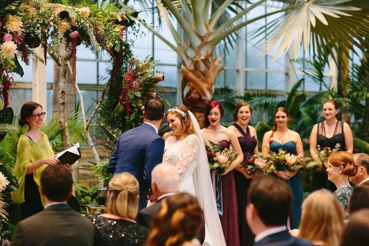 Photo of Rev. Erin Goodman at wedding ceremony at Roger Williams Park Botanical Garden in Providence