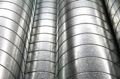 Coiled metal tubes arranged vertically.