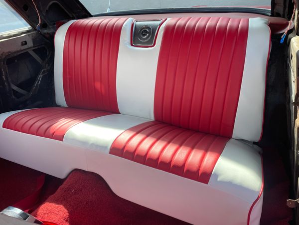 Red and white upholstered seat by Divine Impact LLC, Fairfield upholstery experts
