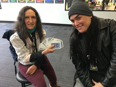 Math instructors Emily and Chris practice card controls.