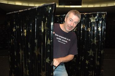 Randy Clower prepares the rain curtains.