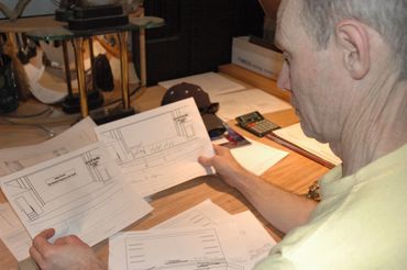 Chris Jenkins, set designer, reviews plans for the the