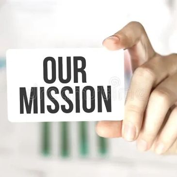 Hand holding a card with the text 'Our Mission' in focus.