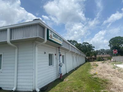 Exterior view of a single-story white building with a sign that reads 'Sheriff's Office'.