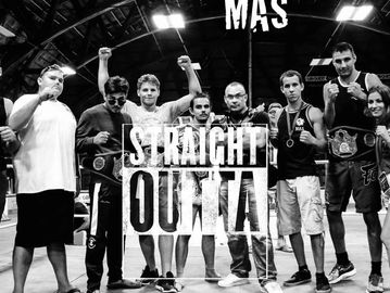 Black and white group photo with text 'Straight Outta'.