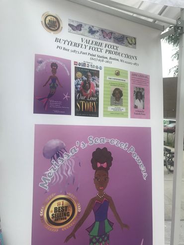 Promotional banner for Valerie Foxx's Butterfly Foxx Productions featuring books and a mermaid character.