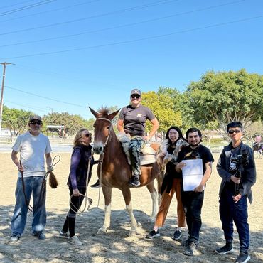An LEC boarder and LEC team working with a film crew on an animation project