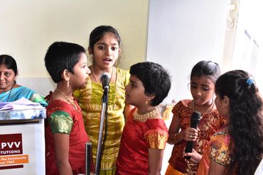 Girl students singing in school competition in Vijayawada as part of co-curricular activities