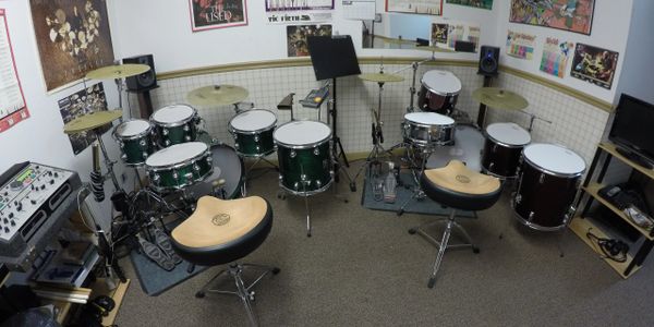 Drum kit room featuring two kits outfitted with Remo silent stoke heads and Zildjian L80 cymbals