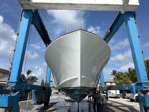 Marine surveyor inspecting a yacht for prospective buyers in Jupiter, Florida