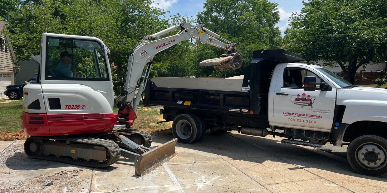 America's Conduit Technicians' equipment on site ready to haul away concrete that is being removed