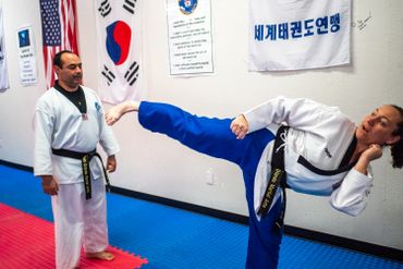 martial arts student demonstrating a kick