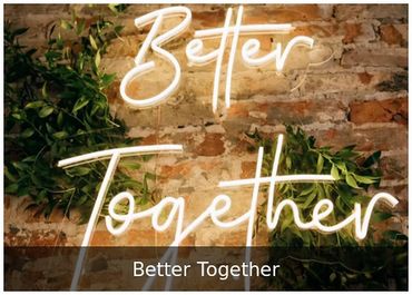 Better Together — Brick and greenery backdrop for weddings.
