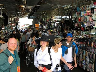 Touring the trendy Carmel Market in Tel Aviv with vibrant stalls and local goods.