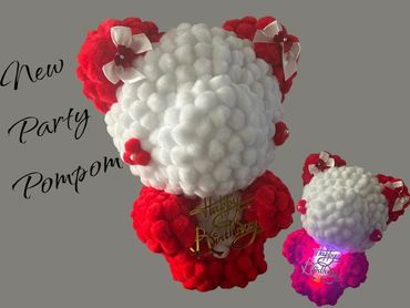 Cute red and white pompom bear with birthday message and bows.