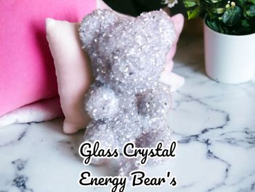 Sparkling glass crystal bear figurine on marble surface.