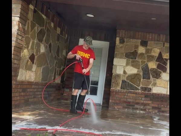 Cleaning and pressure washing a residential patio.